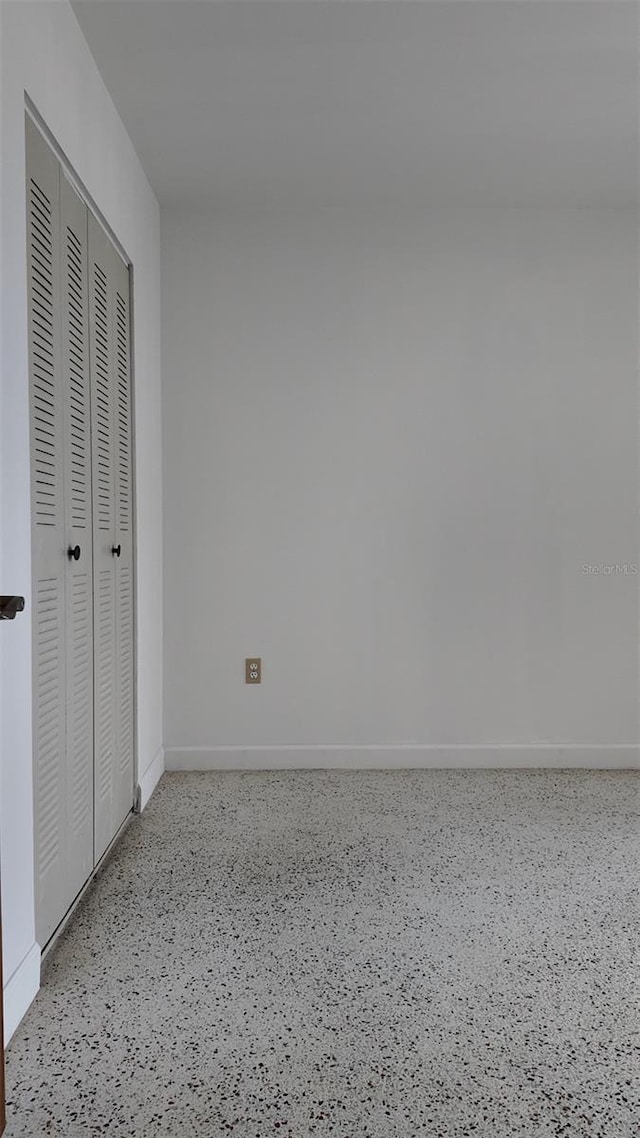 2921 SW 10th St Unit 23, Miami, FL 33135 - unfurnished bedroom with speckled floor and a closet