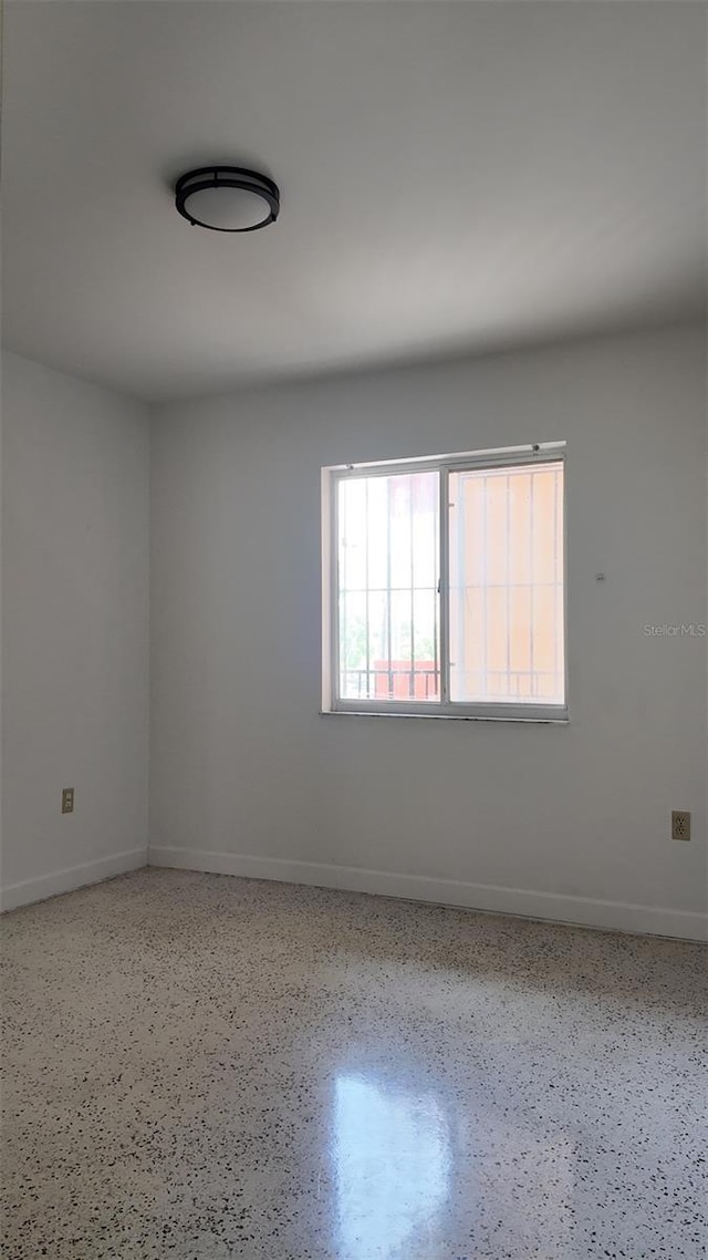 2921 SW 10th St Unit 23, Miami, FL 33135 - empty room with speckle patterned floor