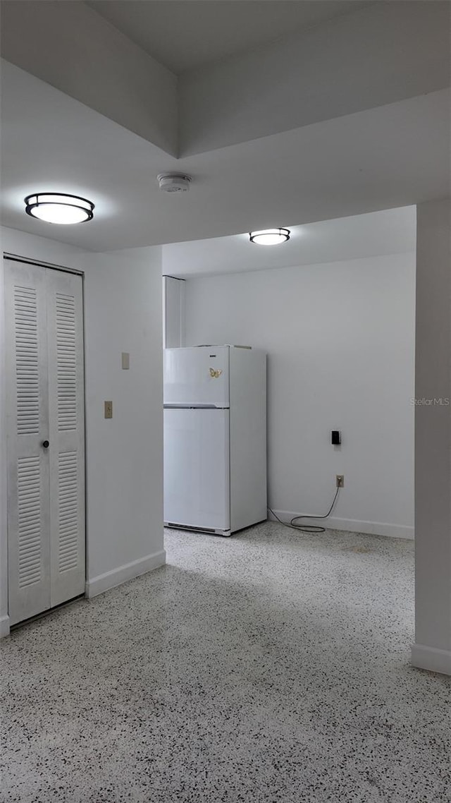 2921 SW 10th St Unit 23, Miami, FL 33135 - spare room with a smoke detector and speckle patterned floor