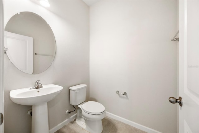 8595 Prairie Creek Dr, New Port Richey, FL 34655 - bathroom with toilet, baseboards, and tile patterned floors