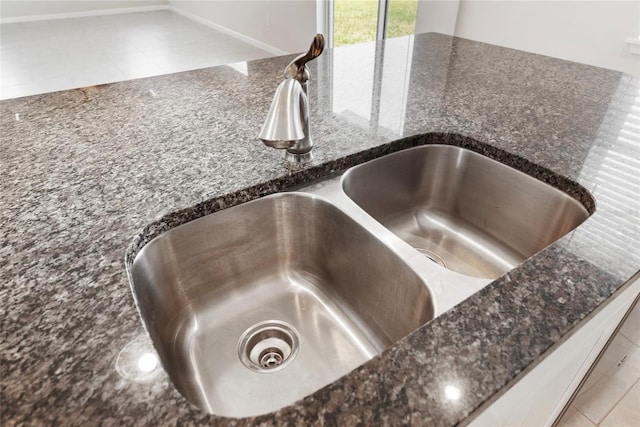8595 Prairie Creek Dr, New Port Richey, FL 34655 - kitchen view of a sink and dark stone countertops
