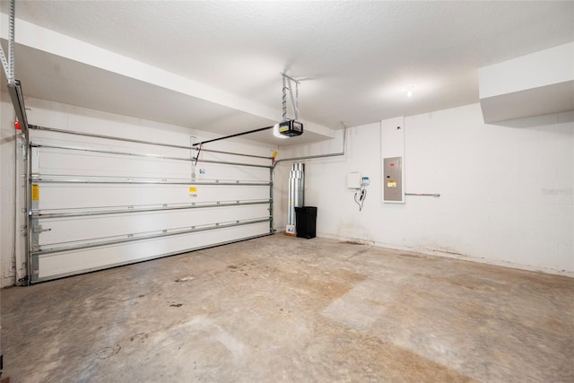 8595 Prairie Creek Dr, New Port Richey, FL 34655 - garage featuring a garage door opener and electric panel