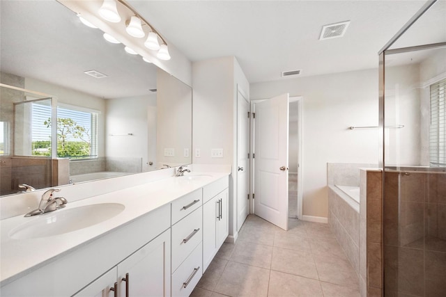 8595 Prairie Creek Dr, New Port Richey, FL 34655 - full bath featuring tile patterned floors, a garden tub, double vanity, and a shower stall