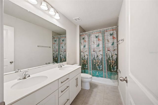 8595 Prairie Creek Dr, New Port Richey, FL 34655 - full bath featuring tile patterned floors, toilet, double vanity, and shower / bath combination with curtain
