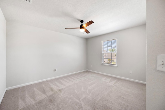 8595 Prairie Creek Dr, New Port Richey, FL 34655 - spare room featuring ceiling fan, carpet flooring, and baseboards