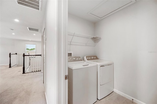 8595 Prairie Creek Dr, New Port Richey, FL 34655 - laundry room with washer and clothes dryer, attic access, baseboards, and recessed lighting