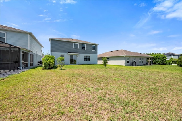 8595 Prairie Creek Dr, New Port Richey, FL 34655 - rear view of house featuring a yard