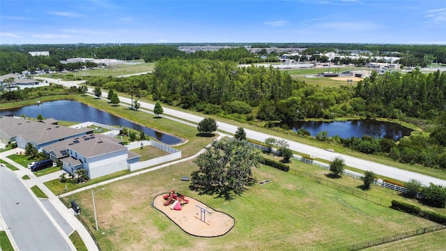 8595 Prairie Creek Dr, New Port Richey, FL 34655 - drone / aerial view of a tree filled landscape and a large body of water