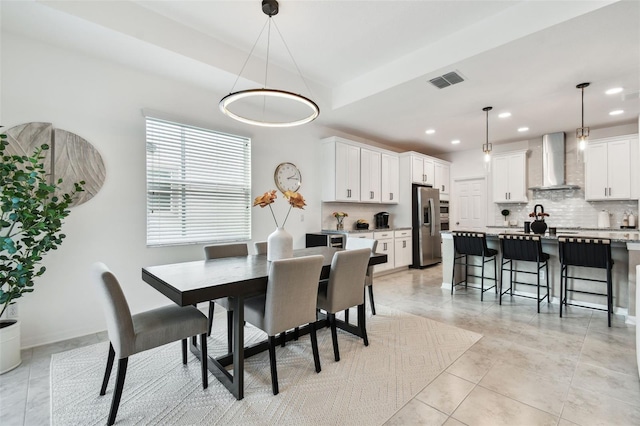dining space featuring recessed lighting