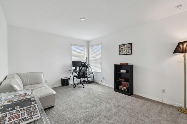 carpeted office with baseboards