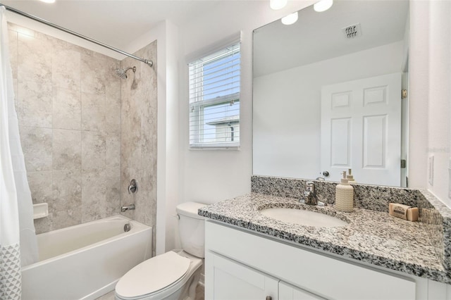 full bathroom with shower / bath combo with shower curtain, toilet, and vanity