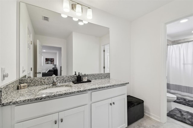 bathroom with vanity, baseboards, toilet, and a shower with curtain