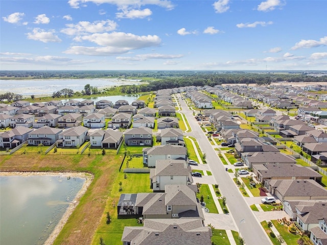 aerial perspective of suburban area featuring a large body of water