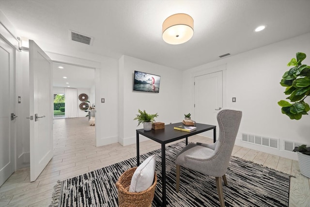 office area featuring visible vents, recessed lighting, and light wood-type flooring