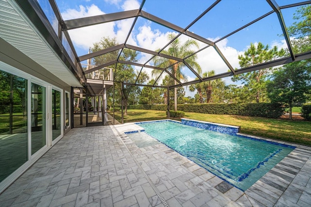 outdoor pool featuring a yard, a lanai, and a patio area