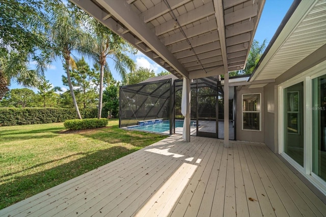 wooden terrace featuring a lawn, an outdoor pool, and a lanai