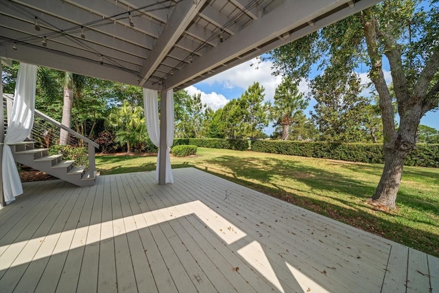 wooden deck with a lawn