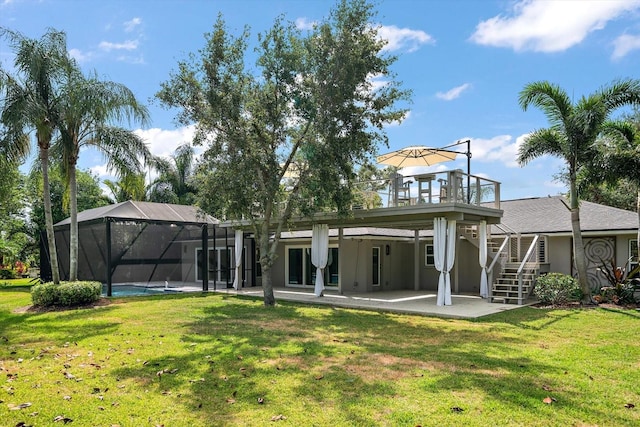 back of property featuring a patio area, a yard, and stairway