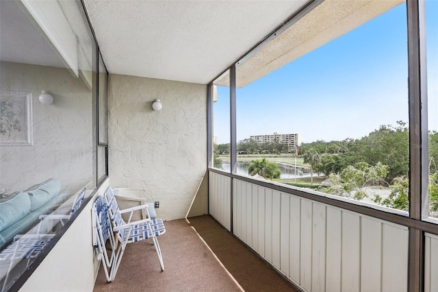 balcony featuring a water view