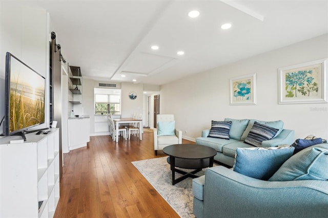 living area with recessed lighting, baseboards, visible vents, and dark wood-type flooring