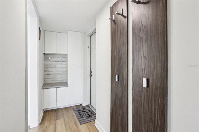 hallway with light wood-type flooring