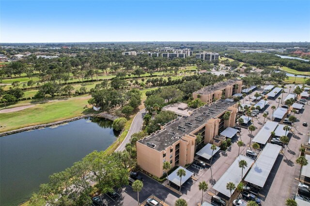 drone / aerial view featuring a water view and golf course view