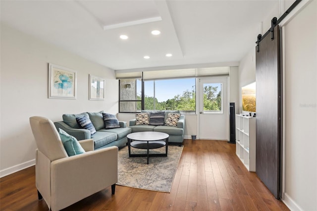 2615 Cove Cay Dr Unit 409, Clearwater, FL 33760 - living room with a barn door, baseboards, dark wood-style floors, and recessed lighting