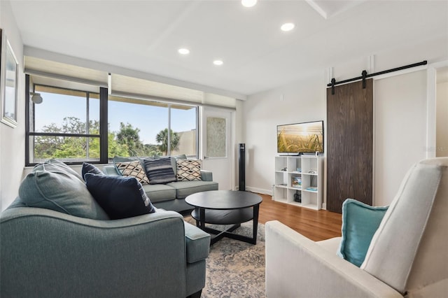 2615 Cove Cay Dr Unit 409, Clearwater, FL 33760 - living area with a barn door, recessed lighting, plenty of natural light, and wood finished floors