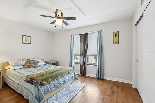 2615 Cove Cay Dr Unit 409, Clearwater, FL 33760 - bedroom featuring ceiling fan, baseboards, a closet, and wood finished floors