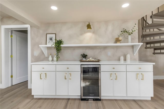 bar featuring wine cooler, light wood-style floors, stairway, recessed lighting, and baseboards