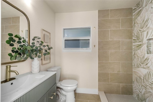 full bath featuring a walk in shower, tile patterned floors, toilet, vanity, and baseboards