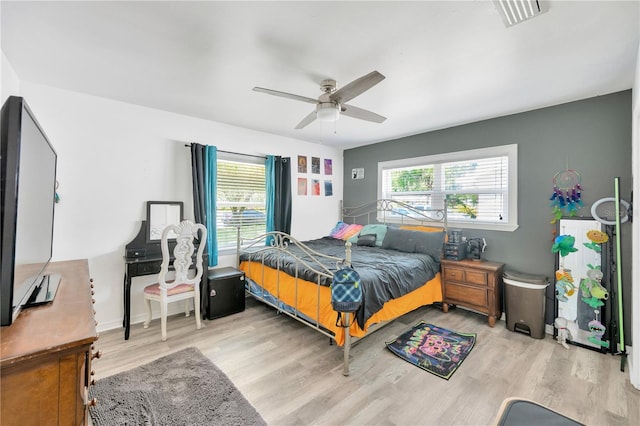 607 Carolyn Dr, Brandon, FL 33510 - bedroom featuring a ceiling fan, wood finished floors, and visible vents