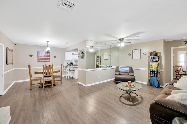 607 Carolyn Dr, Brandon, FL 33510 - living area featuring visible vents, a ceiling fan, baseboards, and wood finished floors