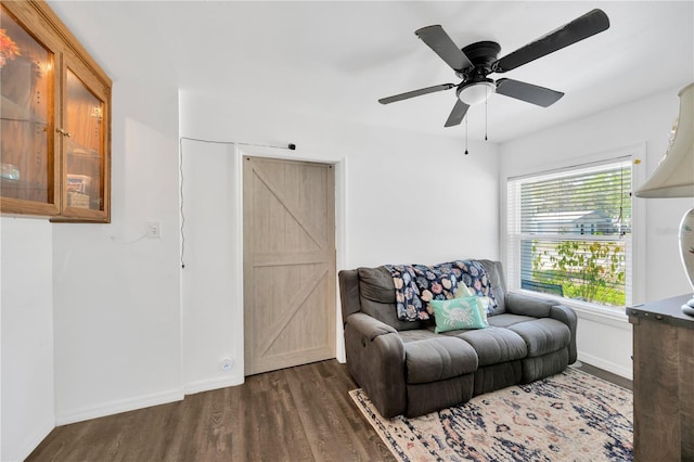 607 Carolyn Dr, Brandon, FL 33510 - sitting room with baseboards, a ceiling fan, wood finished floors, and a barn door