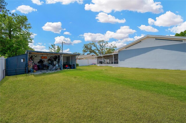 607 Carolyn Dr, Brandon, FL 33510 - view of yard featuring fence and a sunroom