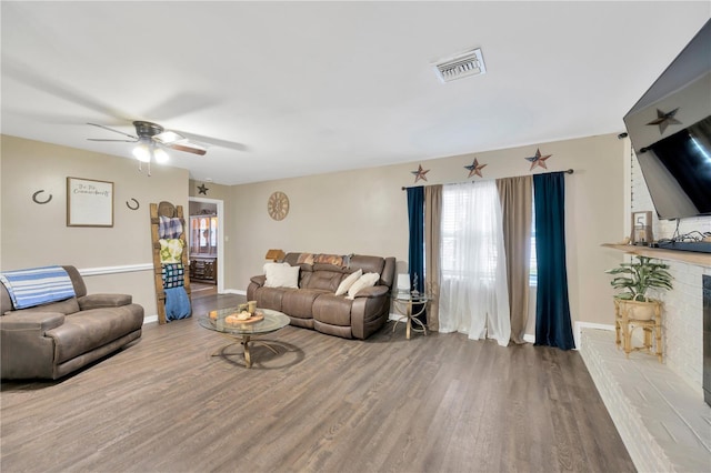 607 Carolyn Dr, Brandon, FL 33510 - living area featuring baseboards, ceiling fan, visible vents, and wood finished floors
