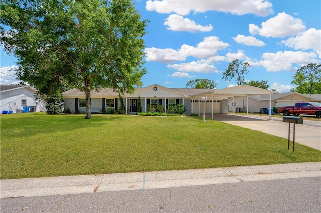 607 Carolyn Dr, Brandon, FL 33510 - ranch-style house with a garage, a front lawn, an attached carport, and concrete driveway
