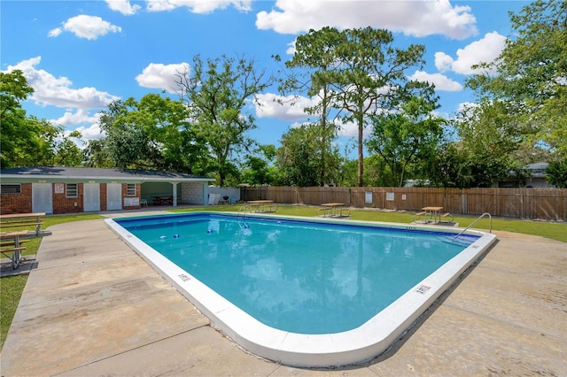 607 Carolyn Dr, Brandon, FL 33510 - community pool with a fenced backyard, a yard, and a patio area