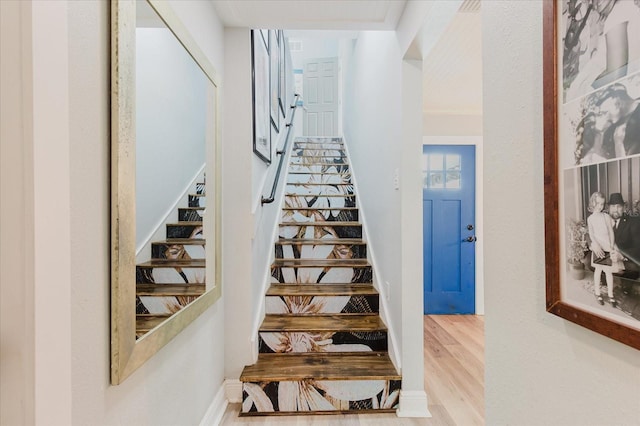 stairs with wood finished floors