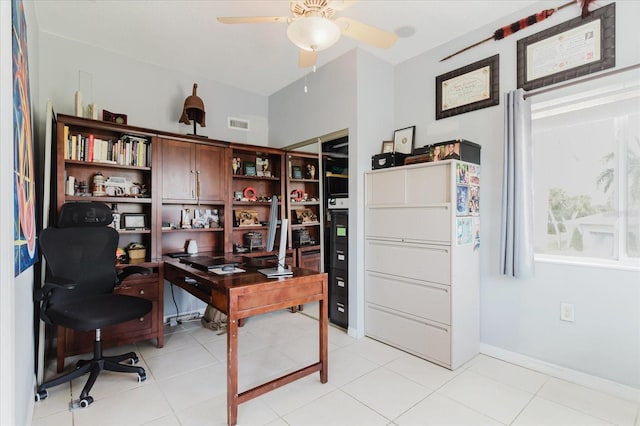 office area featuring baseboards, ceiling fan, light tile patterned floors, and visible vents