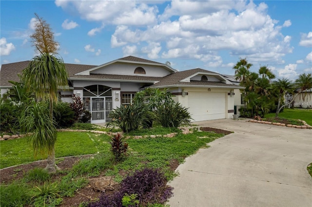 23420 Peachland Blvd, Port Charlotte, FL 33954 - ranch-style home featuring an attached garage, roof with shingles, stucco siding, and driveway