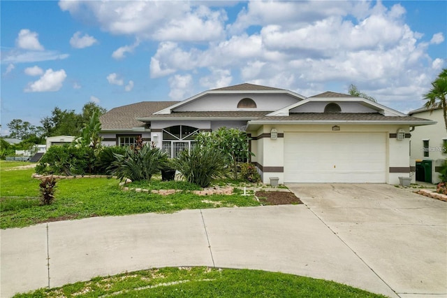 23420 Peachland Blvd, Port Charlotte, FL 33954 - view of front of home featuring driveway, stucco siding, a garage, and a front yard