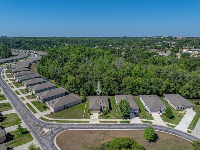 bird's eye view with a forest view and a residential view