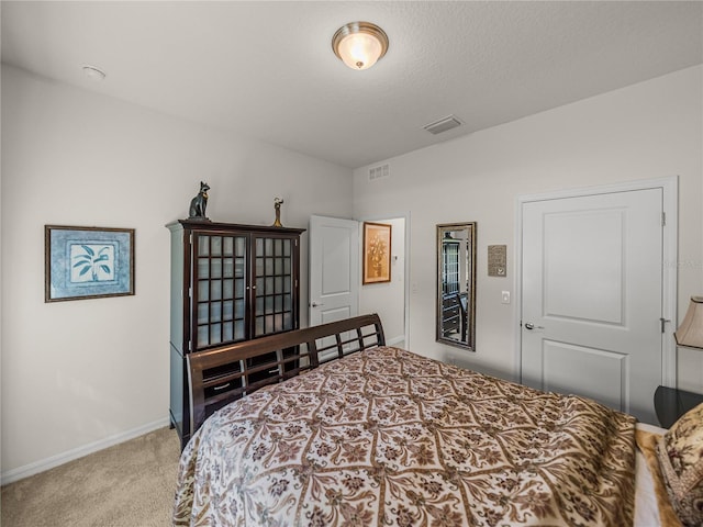 bedroom with carpet flooring, baseboards, and visible vents