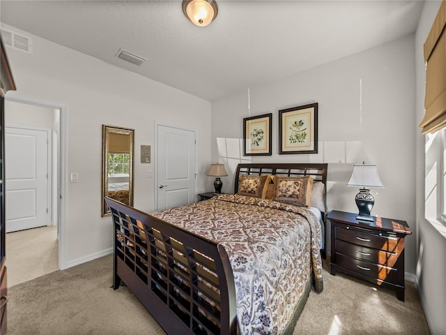 bedroom with carpet flooring, baseboards, and visible vents