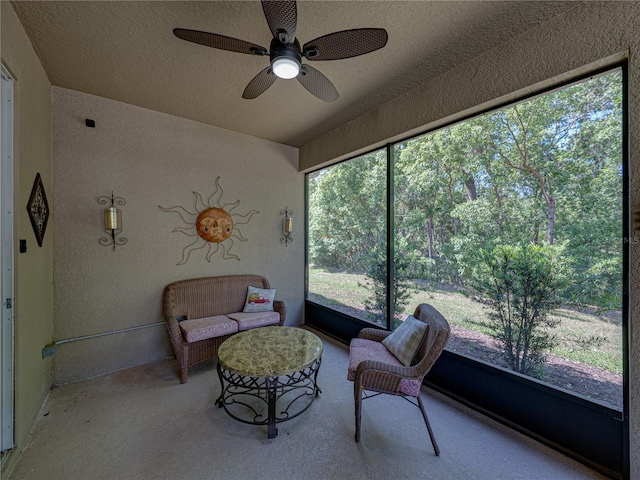 sunroom with a ceiling fan