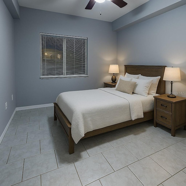 bedroom featuring light tile patterned flooring, a ceiling fan, and baseboards