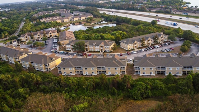 bird's eye view featuring a residential view and a water view