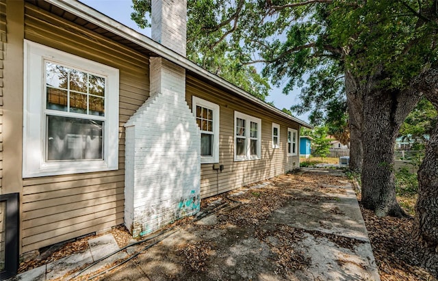 41 W Boyer St, Tarpon Springs, FL 34689 - view of side of home with a chimney