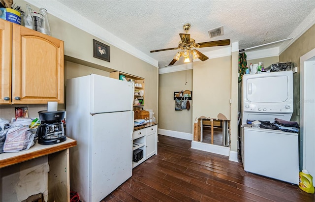 41 W Boyer St, Tarpon Springs, FL 34689 - kitchen with freestanding refrigerator, stacked washer and clothes dryer, a ceiling fan, a textured ceiling, and dark wood-style flooring